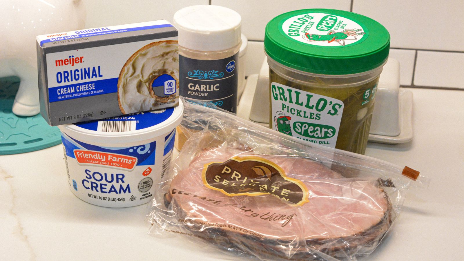 Make this pickle wrap dip with cream cheese, sour cream, pickles, ham, and garlic powder.