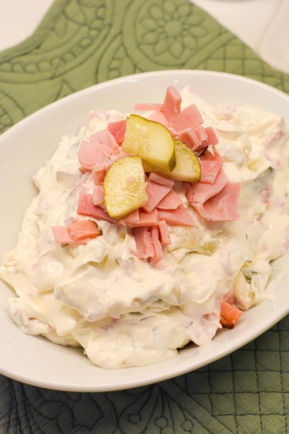 This creamy pickle wrap dip made with deli ham, cream cheese, and dill pickles is the ultimate party appetizer. All the flavor of classic pickle wraps without the work!