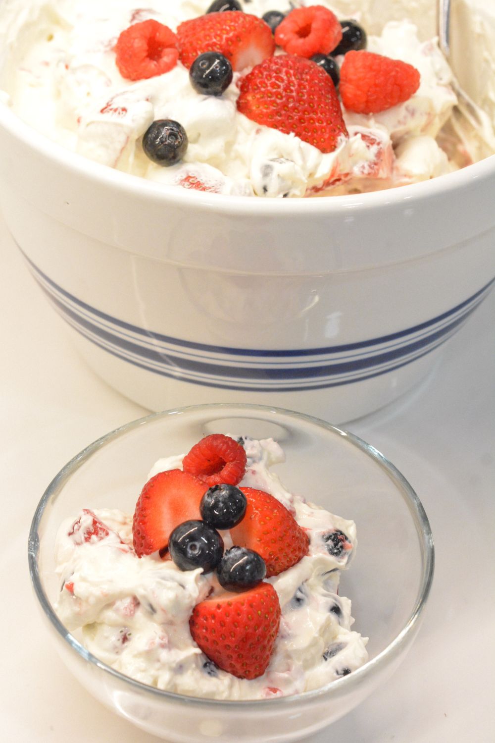 This creamy Berry Cheesecake Salad is packed with fresh berries, cheesecake pudding mix, cream cheese, vanilla Greek yogurt, and whipped topping! It’s an easy, no-bake dessert salad perfect for summer BBQs, potlucks, and holiday brunches. A refreshing and crowd-pleasing recipe that comes together in minutes!