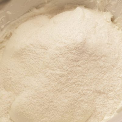 In a large mixing bowl, beat the cream cheese. Then mix the cheesecake pudding mix, vanilla Greek yogurt, and vanilla extract into the cream cheese until smooth and thick.