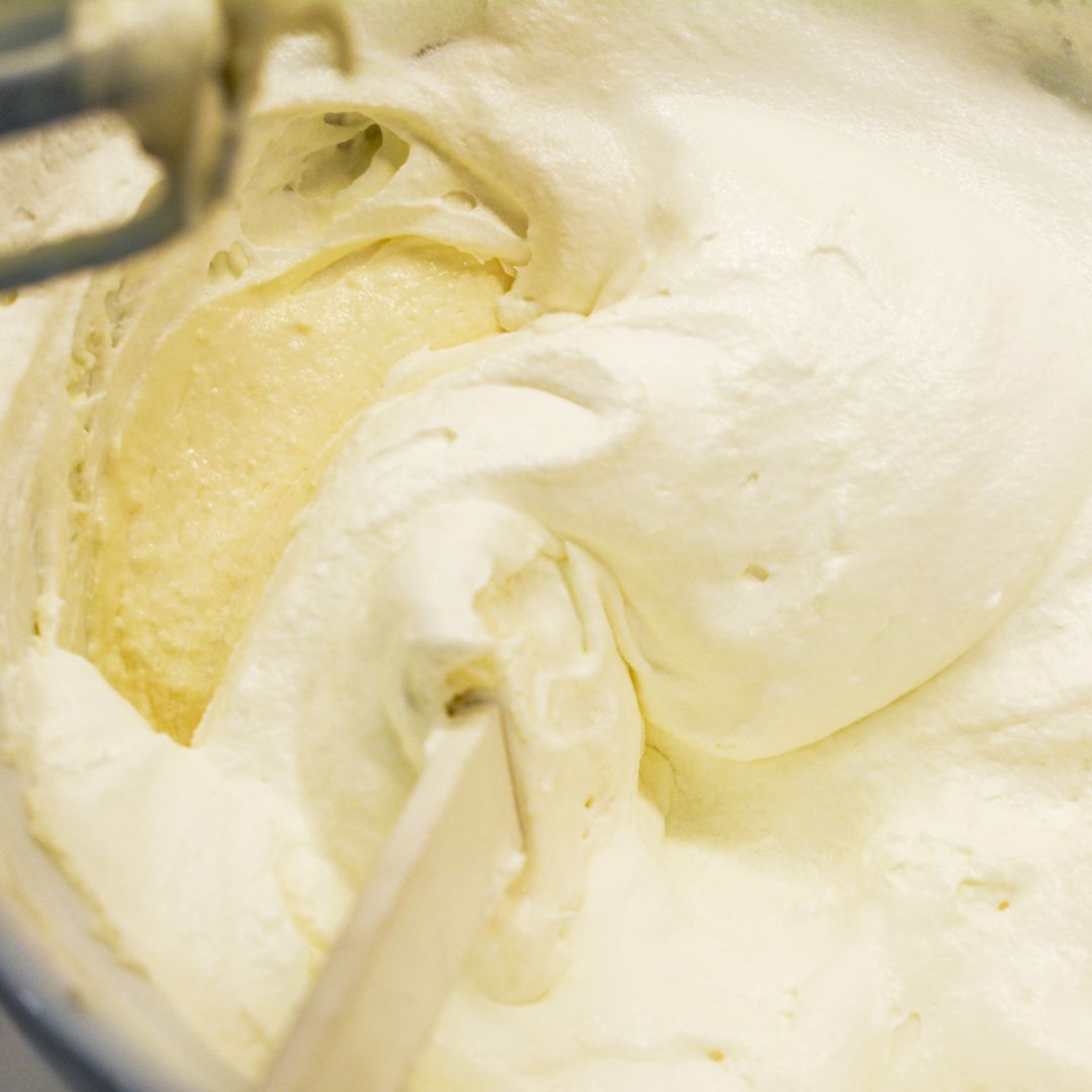 Gently fold in the whipped topping until fully combined. This creates a fluffy, creamy base for your fruit salad.