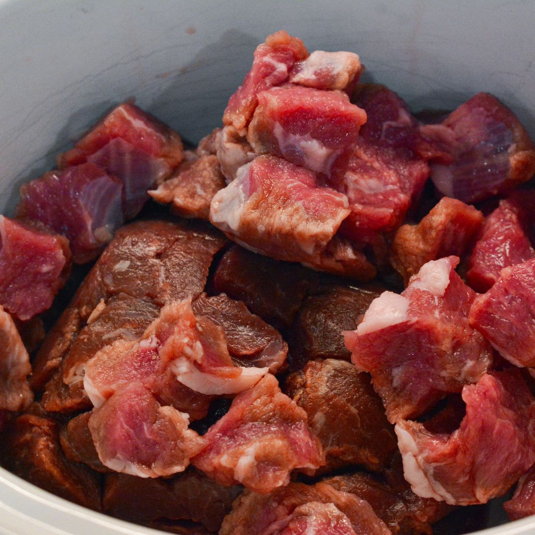 Place beef tips or stew meat in the crock pot.