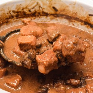 30 minutes before serving, mix cornstarch with cold water and stir into the crock pot. Cook uncovered until the sauce thickens.