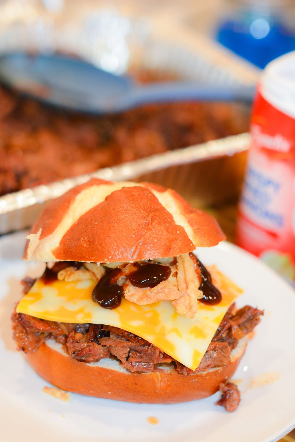 Make hearty Smoked Cowboy Beef Sandwiches with tender chuck roast, barbecue seasoning, and a rich sauce—smoked or slow-cooked in the crock pot, then piled high with cheese, bacon, fried onions, and pickles.