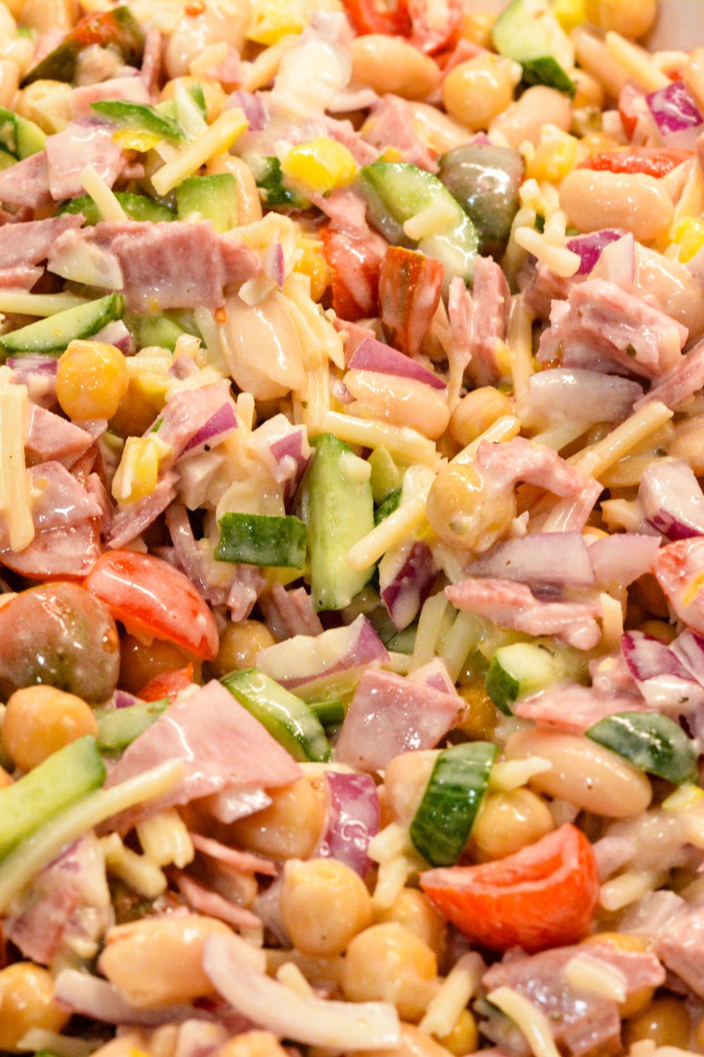 This Italian Grinder Bean Salad is a creamy, no-cook bean salad inspired by BeanTok and classic Italian grinder flavors. Made with chickpeas, cannellini beans, shredded Italian cheese, and a creamy Italian dressing, it’s an easy high-protein lunch or side dish that gets even better as it chills.