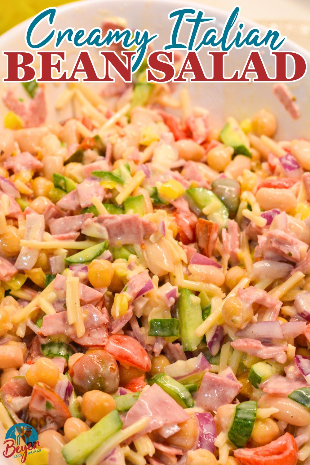 Italian grinder bean salad made with chickpeas, cannellini beans, Italian cheese, and a creamy Italian dressing.